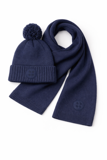 Navy blue knit hat and scarf set on a white background