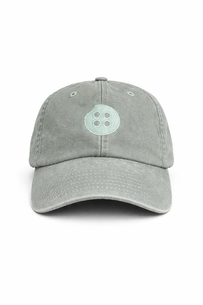 Gray cap with a light tonal logo on a white background